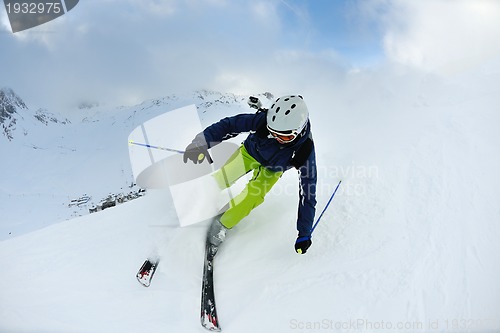 Image of skiing on fresh snow at winter season at beautiful sunny day
