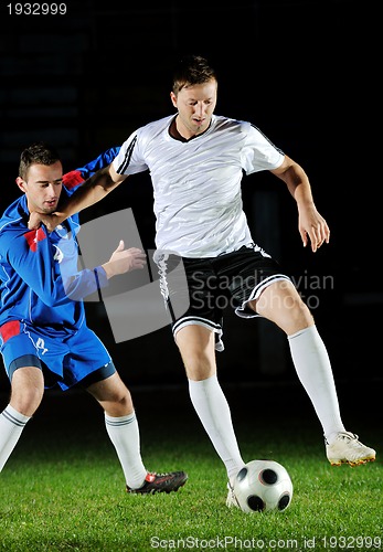 Image of football players in action for the ball