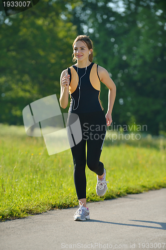 Image of Young couple jogging at morning