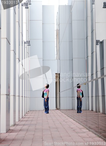 Image of beautiful young woman in the city