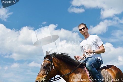 Image of man ride horse