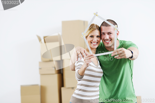 Image of Young couple moving in new house