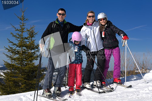 Image of portrait of happy young family at winter