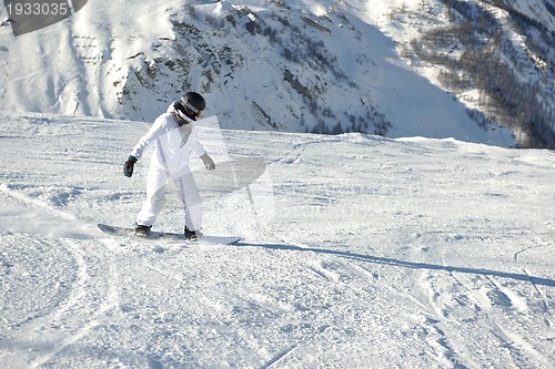 Image of skiing on fresh snow at winter season at beautiful sunny day