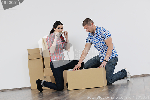 Image of Young couple moving in new house