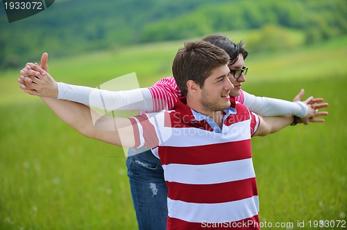 Image of romantic young couple in love together outdoor