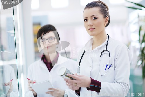 Image of team of pharmacist chemist woman  in pharmacy drugstore