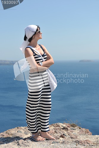 Image of Greek woman on the streets of Oia, Santorini, Greece