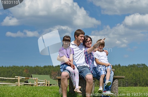 Image of happy young family have fun outdoors