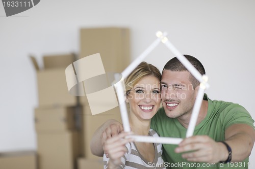 Image of Young couple moving in new home