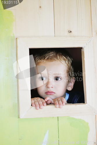 Image of happy child in a window