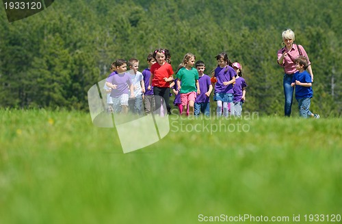 Image of happy kids group  have fun in nature