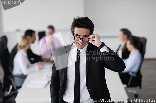 Image of young business man at meeting