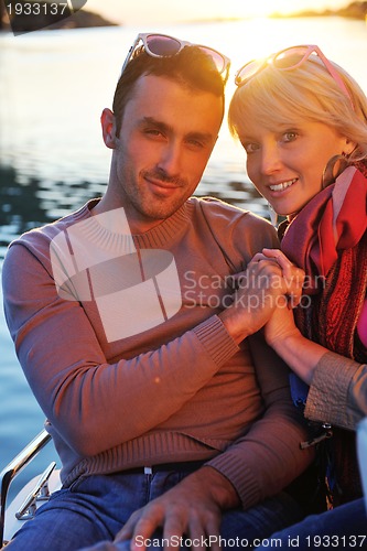 Image of couple in love  have romantic time on boat