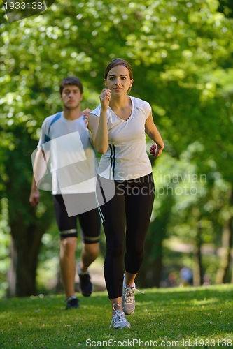 Image of Young couple jogging