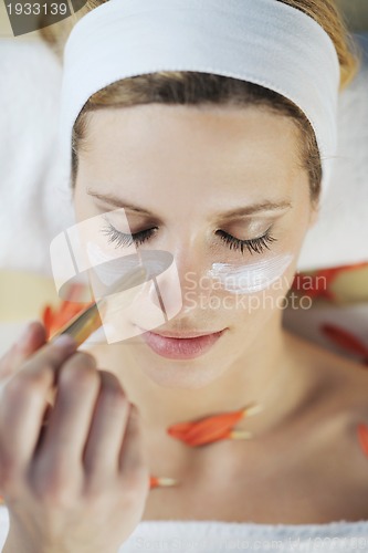 Image of Beautiful young woman in spa