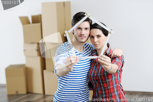 Image of Young couple moving in new house