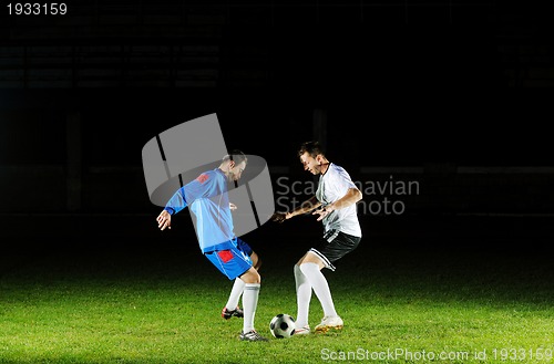 Image of football players in action for the ball