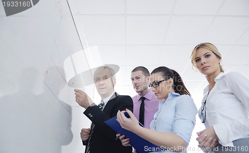 Image of Senior business man giving a presentation