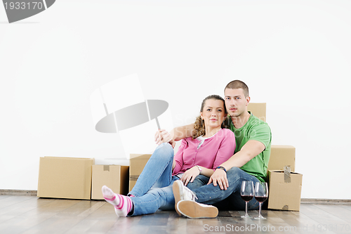 Image of Young couple moving in new house