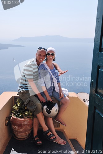 Image of happy young couple tourists in greece