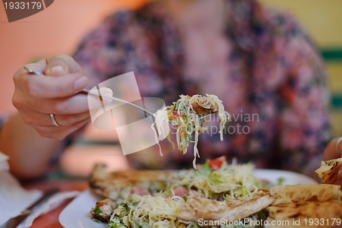 Image of woman eat salad