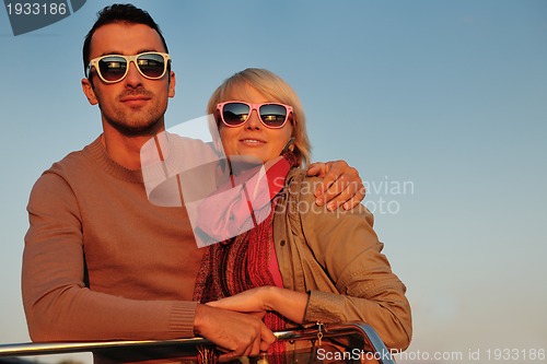 Image of couple in love  have romantic time on boat