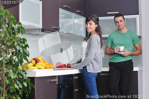 Image of young couple have fun in modern kitchen