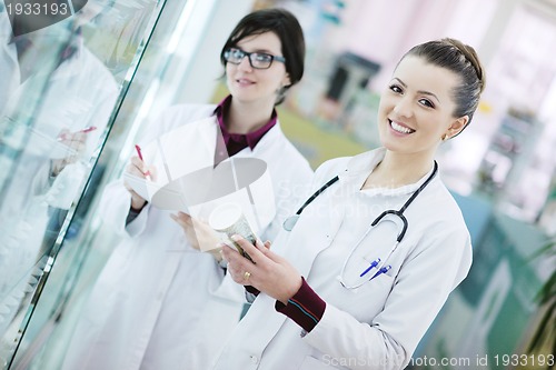 Image of team of pharmacist chemist woman  in pharmacy drugstore