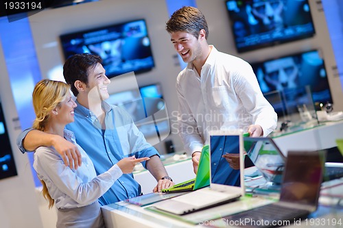 Image of people buy  in consumer electronics store