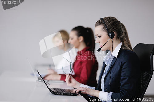 Image of business woman group with headphones