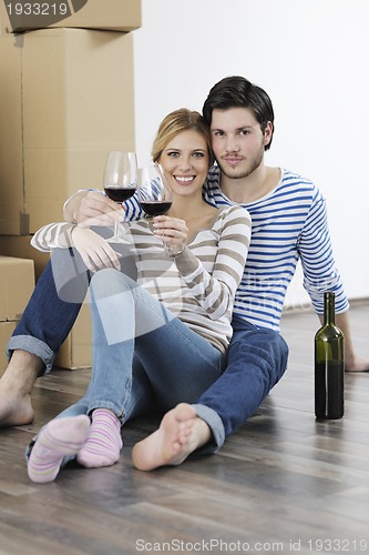 Image of Young couple moving in new home