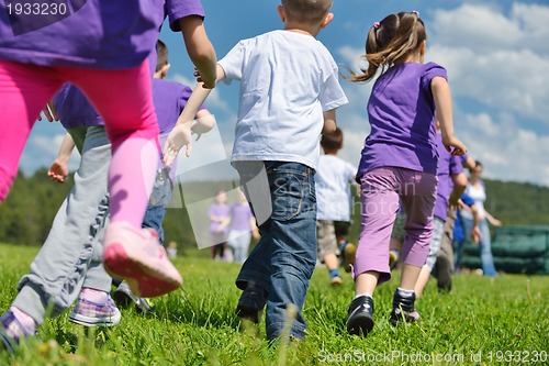 Image of happy kids group  have fun in nature