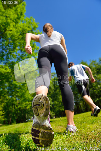 Image of Young couple jogging