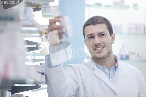 Image of pharmacist chemist man in pharmacy drugstore
