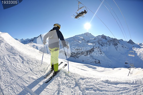 Image of skiing on fresh snow at winter season at beautiful sunny day