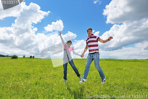 Image of romantic young couple in love together outdoor