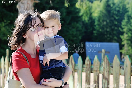 Image of woman and child have fun outdoor