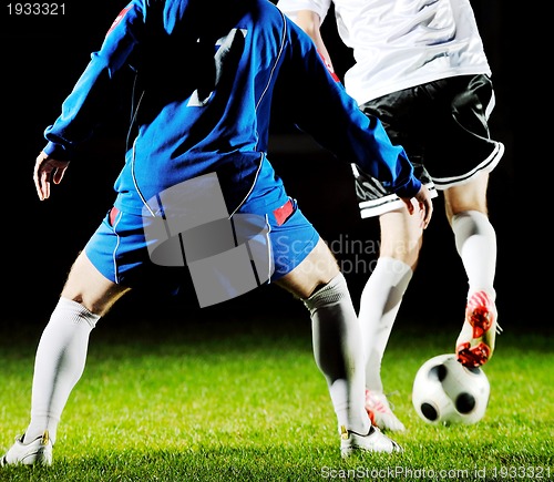 Image of football players in action for the ball