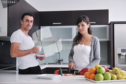 Image of young couple have fun in modern kitchen