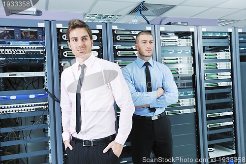 Image of it enineers in network server room