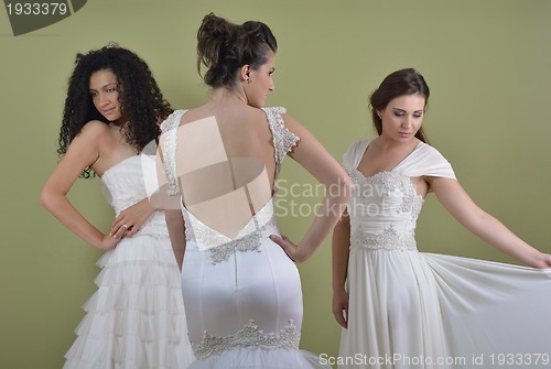 Image of portrait of a three beautiful woman in wedding dress