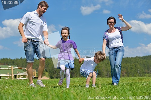 Image of happy young family have fun outdoors