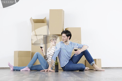 Image of Young couple moving in new home