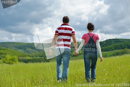 Image of romantic young couple in love together outdoor
