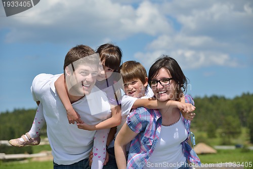 Image of happy young family have fun outdoors