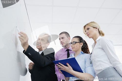 Image of Senior business man giving a presentation