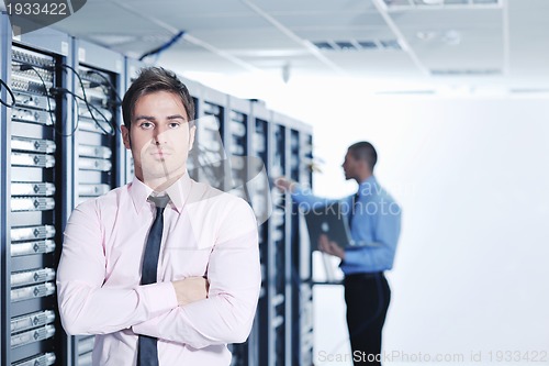 Image of it enineers in network server room