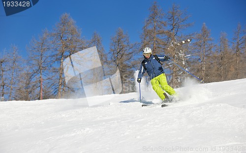 Image of skiing on fresh snow at winter season at beautiful sunny day