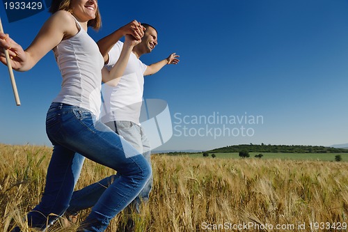Image of happy couple in wheat field